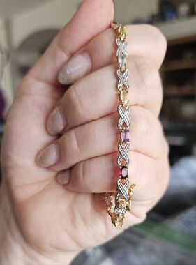 Genuine gemstone bracelet set in sterling silver with a gold wash. Will fit a 7
